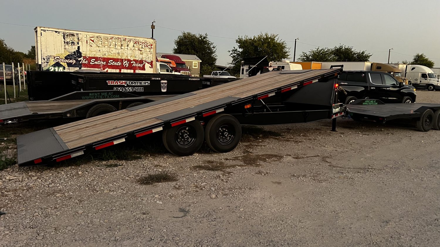 22ft deck-over tilt equipment trailer rental in Texas with deck tilted down
